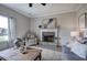 Bright living room features a fireplace, large window, and neutral color palette at 200 Eva Way Ne, Cartersville, GA 30121