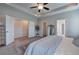 Spacious main bedroom with carpet, gray walls, white trim and ceiling fan at 200 Eva Way Ne, Cartersville, GA 30121