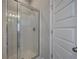 Bathroom featuring glass enclosed shower and white door at 200 Eva Way Ne, Cartersville, GA 30121