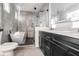 Stylish bathroom with black vanity, a glass enclosed shower and a free standing tub at 262 Crumley St Sw, Atlanta, GA 30312