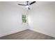 A bedroom features luxury vinyl plank and a window overlooking the outside at 262 Crumley St Sw, Atlanta, GA 30312