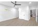 A spacious bedroom with luxury vinyl plank, ceiling fan, and white trim at 262 Crumley St Sw, Atlanta, GA 30312