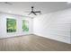 Bright bedroom with two windows and modern accent wall at 262 Crumley St Sw, Atlanta, GA 30312