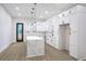Bright kitchen featuring white cabinets, light countertops, an island and stainless steel appliances at 262 Crumley St Sw, Atlanta, GA 30312