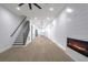 Open-concept living room with an electric fireplace and adjoining kitchen at 262 Crumley St Sw, Atlanta, GA 30312
