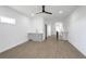Open-concept living space with gray wet bar and luxury vinyl plank flooring at 262 Crumley St Sw, Atlanta, GA 30312
