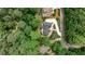 Aerial view of property showcasing a landscaped yard and nestled amongst mature trees at 2682 Boulder Creek Ne Dr, Roswell, GA 30075