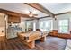 Basement with a pool table and stone bar, perfect for relaxing and recreation at 2682 Boulder Creek Ne Dr, Roswell, GA 30075