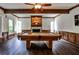 Basement games room with pool table, wood-burning fireplace and coffered ceiling at 2682 Boulder Creek Ne Dr, Roswell, GA 30075