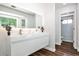 Modern bathroom with a floating vanity, double sinks, and a separate shower room at 2682 Boulder Creek Ne Dr, Roswell, GA 30075