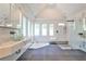 Contemporary bathroom features a glass vessel sink, soaking tub, and frameless shower at 2682 Boulder Creek Ne Dr, Roswell, GA 30075