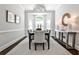 Elegant dining room boasts natural light from the bay window and stylish modern lighting at 2682 Boulder Creek Ne Dr, Roswell, GA 30075