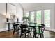 Stylish dining room with French doors, modern light fixtures, and hardwood flooring at 2682 Boulder Creek Ne Dr, Roswell, GA 30075