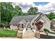 Charming single-Gathering home featuring stone walkway, well-manicured landscaping and a modern roof design at 2682 Boulder Creek Ne Dr, Roswell, GA 30075