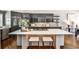 Gourmet kitchen with stainless steel appliances, a large island, and custom cabinetry at 2682 Boulder Creek Ne Dr, Roswell, GA 30075