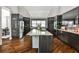 Contemporary kitchen with sleek cabinetry, an island cooktop, and stainless steel appliances at 2682 Boulder Creek Ne Dr, Roswell, GA 30075