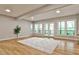 Bright living room with wood floors and large windows overlooking a private deck at 2682 Boulder Creek Ne Dr, Roswell, GA 30075