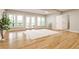 Bright living room with hardwood floors, large windows, and access to the balcony at 2682 Boulder Creek Ne Dr, Roswell, GA 30075
