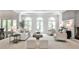 Bright living room with lots of seating, arched windows and doors leading to the outdoor space at 2682 Boulder Creek Ne Dr, Roswell, GA 30075