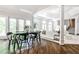 Open-concept living area with dining space, French doors, and views of the surrounding backyard and living area at 2682 Boulder Creek Ne Dr, Roswell, GA 30075