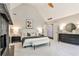 Well-lit main bedroom boasts modern decor, a vaulted ceiling, a fireplace, and ensuite bathroom access at 2682 Boulder Creek Ne Dr, Roswell, GA 30075