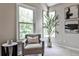 Cozy sitting area with plush chair, natural light, and modern decor at 2682 Boulder Creek Ne Dr, Roswell, GA 30075