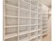 Spacious walk-in closet with custom shelving for optimal organization at 2682 Boulder Creek Ne Dr, Roswell, GA 30075