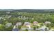 Aerial view of a residential neighborhood nestled among lush trees in a community with well-maintained landscaping at 407 Estates View Dr, Acworth, GA 30101