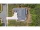 A bird's-eye view shows the roof and surrounding landscaped yard of a luxury home with a curved driveway at 407 Estates View Dr, Acworth, GA 30101