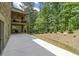 Exterior view highlighting the patio, backyard, and the natural surroundings of the property at 407 Estates View Dr, Acworth, GA 30101
