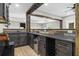 The basement bar features dark cabinetry, a beverage cooler, and wood detailing at 407 Estates View Dr, Acworth, GA 30101