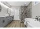 This primary bathroom features a separate shower, a soaker tub, dual sinks, and upgraded fixtures at 407 Estates View Dr, Acworth, GA 30101