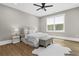 Spacious bedroom features wood flooring, a plush rug, and a window for lots of natural light at 407 Estates View Dr, Acworth, GA 30101