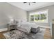 Sunlit bedroom with hardwood floors, large windows and a sitting area at 407 Estates View Dr, Acworth, GA 30101