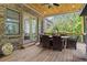 Covered patio with outdoor dining set, seating and access to manicured grounds at 407 Estates View Dr, Acworth, GA 30101