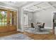 Dining room with a round table, modern light fixture and view to the front door at 407 Estates View Dr, Acworth, GA 30101