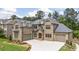 Exterior of a two-story home with a three car garage and well-maintained landscaping at 407 Estates View Dr, Acworth, GA 30101