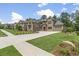 An inviting stone-and-brick home features a long driveway, two-car garage, and lush green lawn at 407 Estates View Dr, Acworth, GA 30101