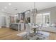 Open concept kitchen and dining area with an island, pendant lights, and large window at 407 Estates View Dr, Acworth, GA 30101