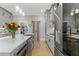 Contemporary kitchen with stainless steel appliances, a large island, and chic pendant lighting at 407 Estates View Dr, Acworth, GA 30101