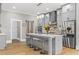 Modern kitchen features gray cabinetry, a stainless steel refrigerator, and quartz countertops at 407 Estates View Dr, Acworth, GA 30101
