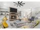 Open-concept living room with fireplace, staircase, and comfortable seating arrangement at 407 Estates View Dr, Acworth, GA 30101
