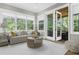 Sunny living room with a door to a covered porch; perfect for indoor/outdoor living at 407 Estates View Dr, Acworth, GA 30101