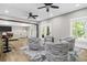 Open living area with wood floors, a decorative rug, and natural light at 407 Estates View Dr, Acworth, GA 30101