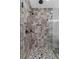 This luxury shower features upgraded tile, fixtures, and frameless glass at 407 Estates View Dr, Acworth, GA 30101