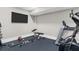 Fully equipped home gym area with varied machines and equipment for exercise at 407 Estates View Dr, Acworth, GA 30101