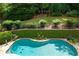 Backyard with lush landscaping and in-ground pool at 4101 Rickenbacker Ne Dr, Atlanta, GA 30342