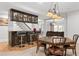 Finished basement with a classy bar, storage, barstools, and seating at 4101 Rickenbacker Ne Dr, Atlanta, GA 30342
