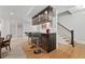 Finished basement with a classy bar, storage, barstools, and a staircase at 4101 Rickenbacker Ne Dr, Atlanta, GA 30342