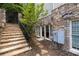 Stone stairs and retaining wall with basement access at 4101 Rickenbacker Ne Dr, Atlanta, GA 30342